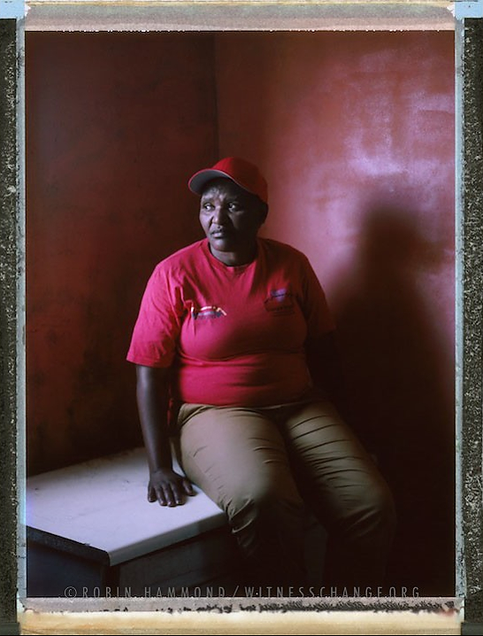 A posed portrait of Funeka Soldaat, 53, who heads Free Gender, a black lesbian organisation working to end homophobia, based in the township of Khaylitsha, Cape Town. When talking about the formation of the group Funeka says “We had to fight or die, we didn’t have a choice”. Funeka is a survivor of sexual violence targeted because of her sexuality, or, as termed by the media a “Victim of corrective rape”.  Her attacker was never convicted. She also survived being stabbed in the back multiple times. The attack landed her in intensive care unit: “when I hear of someone being stabbed, I still feel the pain”. South Africa. November 2014.  While many countries around the world are legally recognizing same-sex relationships, individuals in nearly 80 countries face criminal sanctions for private consensual relations with another adult of the same sex. Violence and discrimination based on sexual orientation or gender expression is even more widespread. Africa is becoming the worst continent for Lesbian, Gay, Bi-sexual, Transgender, Queer, Inter-sex (LGBTQI) individuals. More than two thirds of African countries have laws criminalizing consensual same-sex acts. In some, homosexuality is punishable by death. In Nigeria new homophobic laws introduced in 2013 led to dramatic increase in attacks. Under Sharia Law, homosexuality is punishable by death, up to 50 lashes and six months in prison for woman; for men elsewhere, up to 14 years in prison. Same sex acts are illegal in Uganda. A discriminatory law was passed then struck down and homophobic attacks rose tenfold after the passage of the Anti-Homosexuality Act. In Cameroon it is also illegal. More cases against suspected homosexuals are brought here than any other African country. In stark contrast with the rest of the continent, same sex relationships are legal in South Africa. The country has the most liberal laws toward gays and lesbians on the continent, with a constitution guaranteeing LBGTQI rights. Because of this, LGBTQI Africans from all over the continent fleeing persecution have come to South Africa. Despite these laws, many lesbians have been victims of ‘corrective rape’ and homosexuals have been murdered for their sexuality. Homophobia is by no means just an African problem. In Russia, politicians spread intolerance. In June 2013 the country passed a law making “propaganda” about “non-traditional sexual relationships” a crime. Attacks against gays rose. Videos of gay men being tortured have been posted online. In predominantly Muslim Malaysia, law currently provides for whipping and up to a 20-year prison sentence for homosexual acts involving either men or women. Increased extreme Islamification in the Middle East is making life more dangerous for gay men there, as evidenced by ISIS’s recent murders of homosexual men. While homophobic discrimination is widespread in Lebanon, life is much safer there than Iran, Iraq, and Syria from which refugees are fleeing due to homophobic persecution. Photo Robin Hammond/Panos for Witness Change